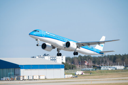 Poland, Gdansk March 28, 2026,A blue and white KLM Cityhopper Embraer aircraft taking off from the runway at Gdansk Lech Walesa Airport (GDN) in Poland under a clear blue sky.