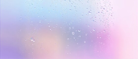 Obraz premium Water drops on a muted pastel background, banner format with empty space for text, suitable for beauty products, wellness branding, or seasonal promotions.