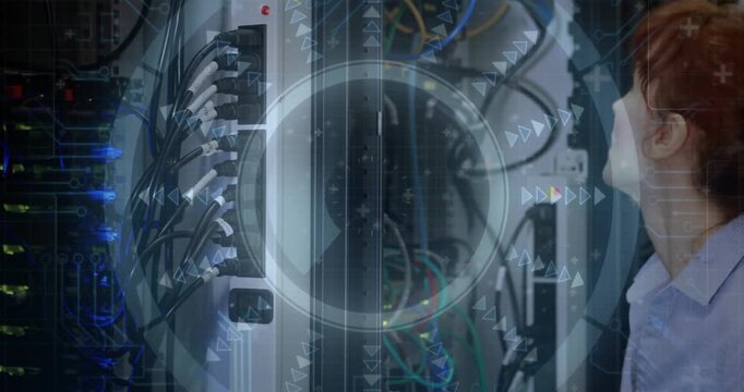 Female IT technician checking server rack in data center, showing AR diagnostics on network cables