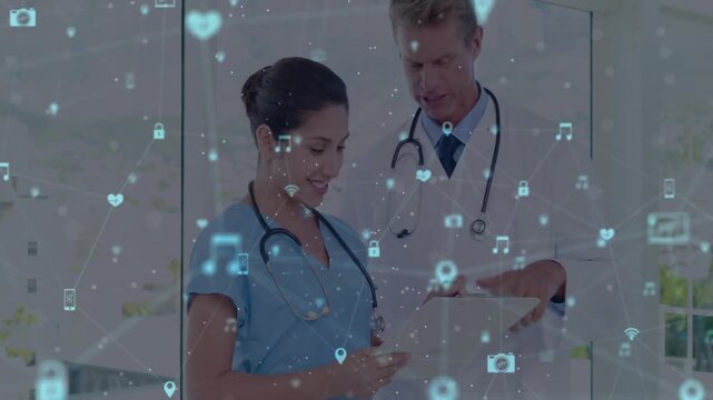 Nurse tapping phone and activating floating icons while doctor annotating patient data clipboard