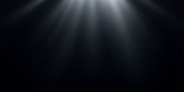 A brushed silver metal plate with a metallic steel texture acts as an empty stage backdrop under a bright spotlight against a dark grey wall