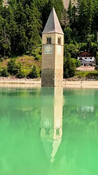 Sunken Bell Tower of Alt Graun in Lake Reschen South Tyrol Italy 4K