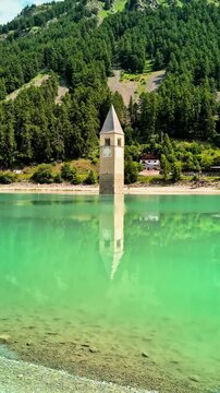 Sunken Bell Tower of Alt Graun in Lake Reschen South Tyrol Italy 4K