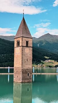 Sunken Bell Tower of Alt Graun in Lake Reschen South Tyrol Italy 4K