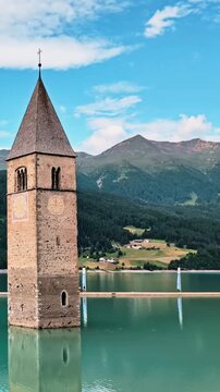 Sunken Bell Tower of Alt Graun in Lake Reschen South Tyrol Italy 4K