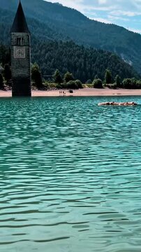 Sunken Bell Tower of Alt Graun in Lake Reschen South Tyrol Italy 4K