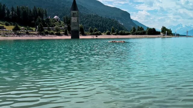 Sunken Bell Tower of Alt Graun in Lake Reschen South Tyrol Italy 4K