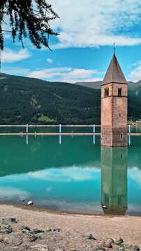Sunken Bell Tower of Alt Graun in Lake Reschen South Tyrol Italy 4K