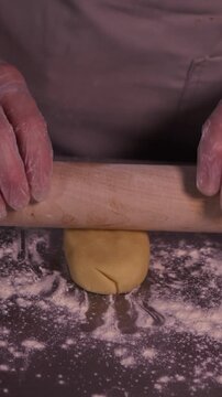 A girl cooks pies with cottage cheese . Vertical video about homemade pastries, cooking and confectionery