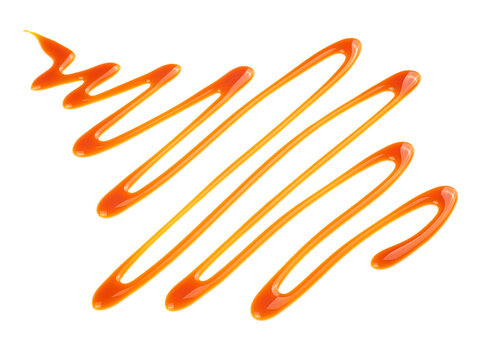 Liquid sweet caramel sauce isolated on a white background. Golden butterscotch toffee caramel. Cream dessert sauce.