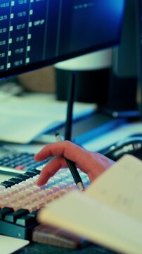 Financial workspace keyboard typing pen monitor data analysis professional trading setup charts screen focus productivity investment fintech business environment technology workflow