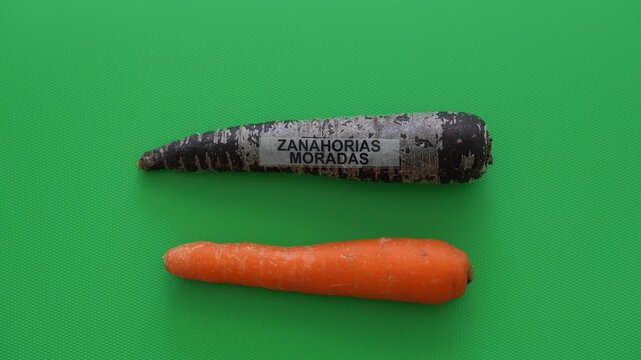 Stop motion animation of purple and orange carrots gradually disappearing one by one, leaving an empty green surface behind schedule