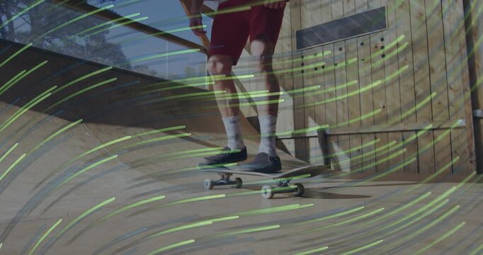 Skateboarder crouching at ramp and drawing green flow lines by launching ollie for sports analysis