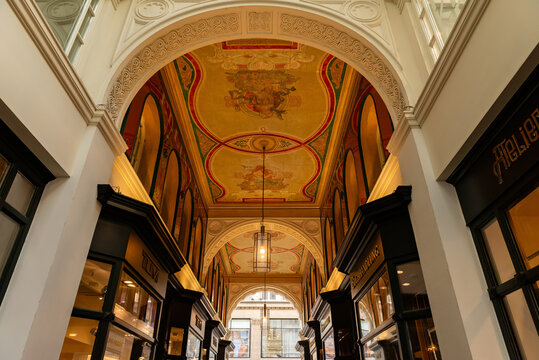 HAMBURG, GERMANY - MARCH 07, 2026: Interior view of the historic Mellin Passage with ornate ceiling frescoes and luxury shops in downtown Hamburg