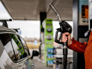 Man'S Hand Holding Fuel Pump