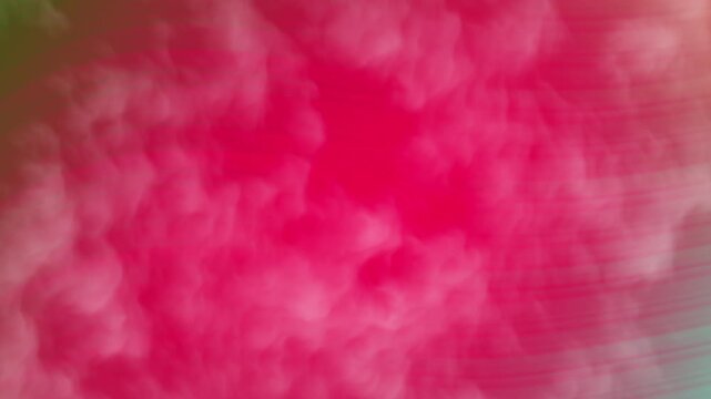 Dynamic pink cloudscape with swirling textures and soft, dreamy visuals creates a vibrant abstract background for creative projects
