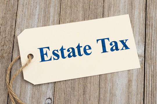 Estate tax gift tag on rustic wood desk