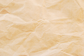 Fototapeta premium Crumpled fine brown kraft paper texture as background