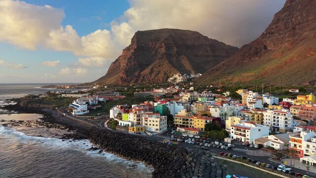 Aerial view of the colorful coastal village Vueltas, Gomera, Canary Islands, Spain. Small harbor and town on the shore of the Atlantic Ocean in Vueltas village, Gomera, Canary Islands, Spain