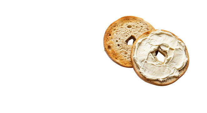 Toasted golden bagel with creamy white schmear, fresh breakfast bagel halves with cream cheese, delicious morning snack with soft cheese spread isolated PNG with Transparent Background