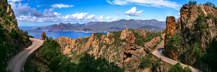 Calanques de Piana 13k panorama of scenic drive on D81 road in Corsica. Best routes in Europe for road trip with dramatic red cliffs and sea view. Famous winding coastal highway in France © Freesurf