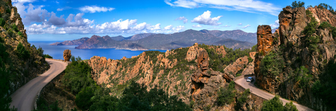 Calanques de Piana 13k panorama of scenic drive on D81 road in Corsica. Best routes in Europe for road trip with dramatic red cliffs and sea view. Famous winding coastal highway in France