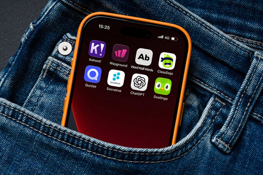 Antalya, Turkey - March 24, 2026: Multiple education apps on smartphone inside denim pocket concept