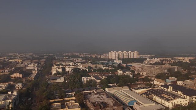 Local traffic, including cars, motorbikes, and rickshaws navigating a four-way junction.