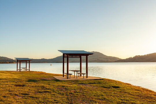 picnic shelter and table in sunset light on lake shoreline in the Hunter Valley