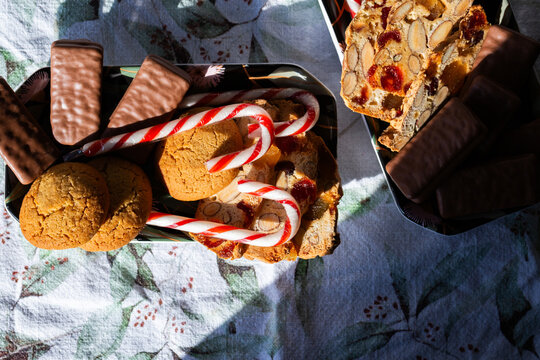 tray of candy canes and homemade ginger biscuits and tim tams on table at Christmas party