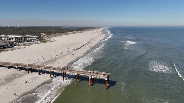 Aerial view overlooking St Augustine beach pier near Anastasia State Park in St Augustine, Florida. 