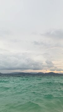 Khai Nok Island turquoise sea and sandy beach panoramic view near Phuket Thailand, tropical island scenery.