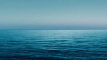 Obraz premium Tranquil Blue Horizon with Minimalist Ocean and Smooth Gradient Sky Capturing Peaceful Serenity