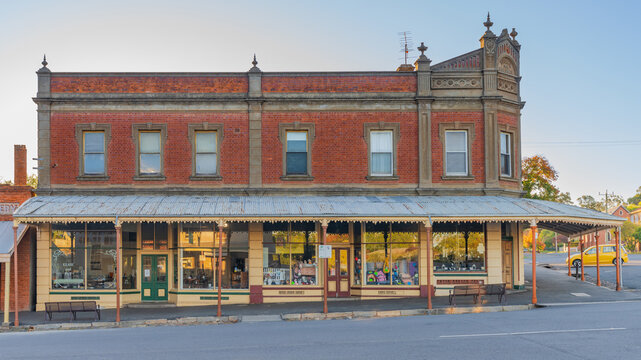 Low angled view of a prominent historic building on a street corner in a small country town