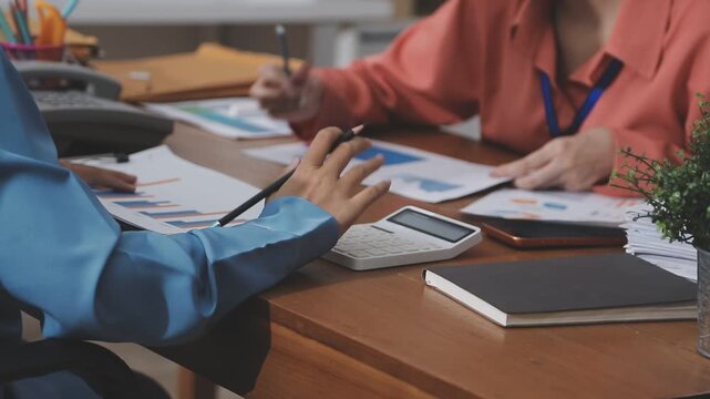 Accounting company provide finance and taxation planning for profitable cash flow, Auditor and accountant team working in office, analyze financial data and accounting record with calculator.Insight
