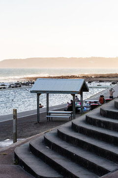 Stairs beside Merewether ocean baths shadowed in the evening light