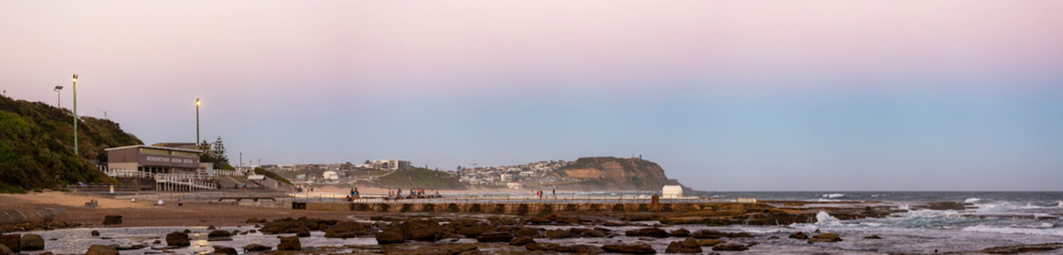 Merewether Ocean Baths coastal landscape at dusk looking towards Nobbys Head