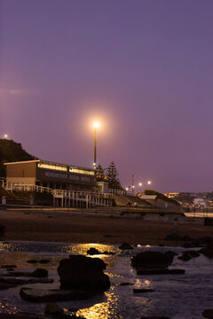 Merewether Ocean Baths building on coast at dusk