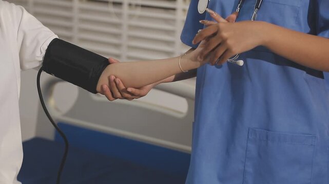 doctor and patient measuring blood pressure