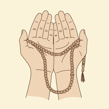 Hands holding prayer beads for religious devotion.