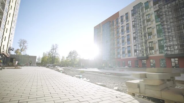 Construction site of new luxury dwelling district in spring town. Development of comfortable residential complex in urban environment