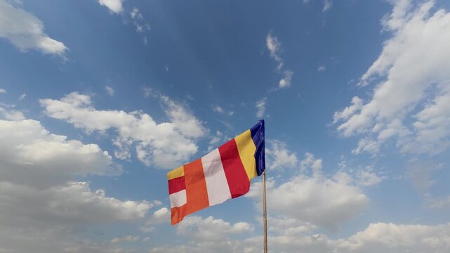Colourful Buddhist Flags Video Footage: flutters in the wind against the blue-sky.