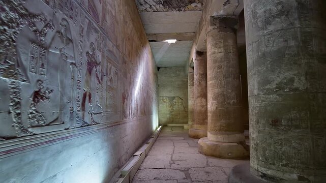 Ancient hall of the Abydos Temple with towering columns and intricate hieroglyphs, showcasing the spiritual depth and architectural mastery of Ancient Egypt.