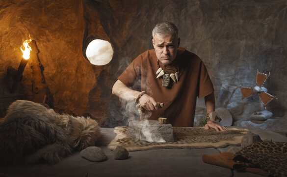 Prehistoric Housework: Funny Bored Caveman Ironing Fur with a Hot Stone Iron