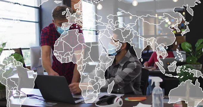 Standing man leaning over laptop and pointing, initiating world map overlay, guiding business work