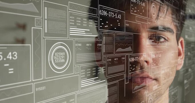 Man standing watching tech starting data stream for monitoring, HUD overlaying him, updating charts