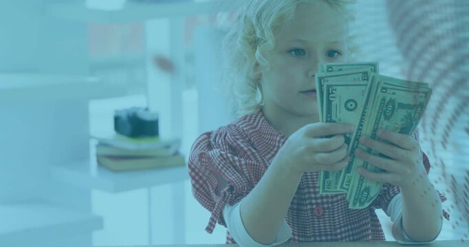 Girl picking bills, counting and fanning at table while dotted panel drifting, learning finance