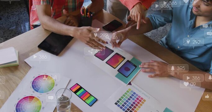 Designers nudging phone mockups and swatches to align layouts, causing animated engagement metrics