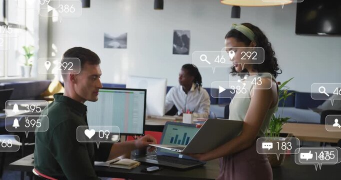 Woman presenting laptop to seated man, social icons growing over charts and people for marketing