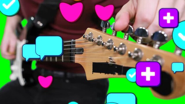 Tuning guitarist in red top and black strap adjusting headstock at green screen, floating icons